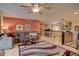 Spacious living room flows to the kitchen with island seating, creating an inviting and open space at 13959 W Cedar Pl, Golden, CO 80401