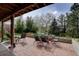 Relaxing brick patio perfect for outdoor dining and entertaining amidst a lush, landscaped backyard at 13959 W Cedar Pl, Golden, CO 80401