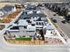 An aerial view shows a modern home with solar panels, well-kept landscaping, and a cozy backyard patio at 6353 N Fulton St, Denver, CO 80238