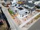 An aerial view showcases a contemporary home featuring modern landscaping and a backyard patio at 6353 N Fulton St, Denver, CO 80238