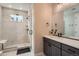 Elegant bathroom with walk-in shower, marble tile, and sleek fixtures at 6353 N Fulton St, Denver, CO 80238