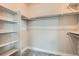 Walk-in closet featuring carpet and white shelving and clothing rods at 6353 N Fulton St, Denver, CO 80238