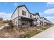 Modern two-story home with eye-catching gray and white color scheme and a cozy front porch at 3580 W 62Nd Pl, Denver, CO 80221