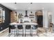 Modern kitchen featuring a center island, stainless steel appliances, and floating shelves at 3580 W 62Nd Pl, Denver, CO 80221