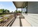 Covered porch with rod iron railing and view of community at 3580 W 62Nd Pl, Denver, CO 80221
