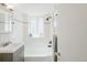 Clean bathroom with a tub, shower, and updated vanity at 1101 Bellaire St # 204, Denver, CO 80220