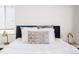 Well-lit bedroom with a comfortable bed and stylish decor at 1101 Bellaire St # 204, Denver, CO 80220