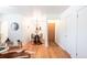 Bright entryway with hardwood floors and dining table at 1101 Bellaire St # 204, Denver, CO 80220