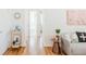 Clean and bright hallway with hardwood floors and a view of the bath at 1101 Bellaire St # 204, Denver, CO 80220