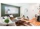 Open living area with a modern aesthetic and hardwood floors at 1101 Bellaire St # 204, Denver, CO 80220