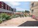 Shared patio area with seating and bike parking at 1101 Bellaire St # 204, Denver, CO 80220