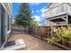 Small, fenced backyard with dirt and some plants at 14700 E 104Th Ave # 1701, Commerce City, CO 80022