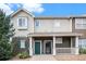 Inviting exterior of a two-story townhome with a covered porch at 14700 E 104Th Ave # 1701, Commerce City, CO 80022