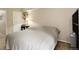 Cozy bedroom featuring neutral tones, with a double bed and tasteful decor for a relaxing ambiance at 3518 S Depew St # 102, Lakewood, CO 80235