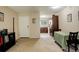 Open-concept living space with a dining area and a kitchen view, creating a bright and welcoming atmosphere at 3518 S Depew St # 102, Lakewood, CO 80235