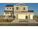 Charming two-story home featuring a two-car garage and covered front porch at 42972 Colonial Trl, Elizabeth, CO 80107