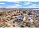 Aerial shot of a two-story home in a neighborhood near the city at 4520 W Moncrieff Pl, Denver, CO 80212