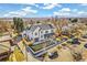 Overhead view of modern two-story home with manicured lawn and mountain view at 4520 W Moncrieff Pl, Denver, CO 80212