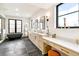 Spa-like bathroom with dual vanities and modern fixtures at 4520 W Moncrieff Pl, Denver, CO 80212