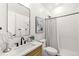 Modern bathroom features a sleek vanity, stylish mirror, and a walk-in shower at 4520 W Moncrieff Pl, Denver, CO 80212