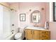 Pink bathroom with modern fixtures and elegant design at 4520 W Moncrieff Pl, Denver, CO 80212
