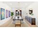 Elegant dining room with modern decor, stylish lighting, and ample seating at 4520 W Moncrieff Pl, Denver, CO 80212