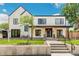 Stylish two-story home boasts modern design and a welcoming front porch with seating at 4520 W Moncrieff Pl, Denver, CO 80212
