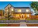 Inviting two-story home with a well-manicured lawn and a charming covered porch at 4520 W Moncrieff Pl, Denver, CO 80212