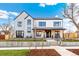 Inviting two-story home with modern farmhouse style and manicured front yard at 4520 W Moncrieff Pl, Denver, CO 80212