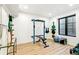 Well-equipped home gym with weightlifting equipment, providing a convenient space for fitness activities at 4520 W Moncrieff Pl, Denver, CO 80212