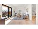 Cozy living room with plush seating and balcony access with scenic views at 4520 W Moncrieff Pl, Denver, CO 80212