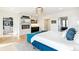 Serene bedroom featuring a fireplace, wet bar, and walk-in closet at 4520 W Moncrieff Pl, Denver, CO 80212