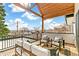 Relaxing outdoor deck with comfortable seating and scenic views at 4520 W Moncrieff Pl, Denver, CO 80212
