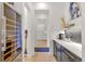 Pantry area with built-in wine cooler, modern cabinets and decor at 4520 W Moncrieff Pl, Denver, CO 80212