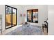 Sunlit playroom with large windows, comfortable seating and easy access to outdoor space at 4520 W Moncrieff Pl, Denver, CO 80212