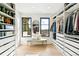 Organized walk-in closet with custom shelving and ample storage at 4520 W Moncrieff Pl, Denver, CO 80212