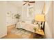 Cozy bedroom with a ceiling fan, natural light, neutral decor and stylish furnishings at 1140 Columbine St # 106, Denver, CO 80206