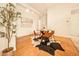 Well lit dining area with wood floors, a round table with seating for four, and bright white walls at 1140 Columbine St # 106, Denver, CO 80206