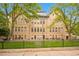 Beautiful brick building with large windows and green lawn, a blend of classic charm and modern living at 1140 Columbine St # 106, Denver, CO 80206