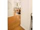 Hallway with wood floors leading to dining area and living room at 1140 Columbine St # 106, Denver, CO 80206