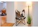 Hallway with a unique chair and modern lamp, adding a touch of elegance to the home at 1140 Columbine St # 106, Denver, CO 80206