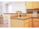 Kitchen bar featuring modern cabinetry, designer backsplash, stone countertops, and stainless steel appliances at 1140 Columbine St # 106, Denver, CO 80206