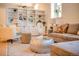 Stylish living room featuring custom shelving, natural light, and comfortable seating arrangement at 1140 Columbine St # 106, Denver, CO 80206