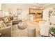Open-concept living room features stylish seating, modern decor, and a seamless transition to the kitchen at 1140 Columbine St # 106, Denver, CO 80206