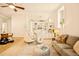 Open-concept living space with built-in shelving, modern furniture, hardwood floors, and plenty of natural light at 1140 Columbine St # 106, Denver, CO 80206