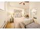 A cozy main bedroom features a calm color palette, lamps, and art at 1140 Columbine St # 106, Denver, CO 80206