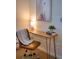Cozy office space with a sleek desk, stylish chair, and natural light, an ideal work-from-home setup at 1140 Columbine St # 106, Denver, CO 80206