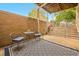 Inviting private outdoor patio with seating, textured rug and a view of the exterior stairs at 1140 Columbine St # 106, Denver, CO 80206