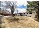 Spacious backyard featuring a well-maintained lawn and patio with outdoor furniture at 3400 S Ivy Way, Denver, CO 80222