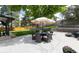 Beautiful backyard with patio seating and an umbrella, perfect for outdoor relaxation at 3400 S Ivy Way, Denver, CO 80222